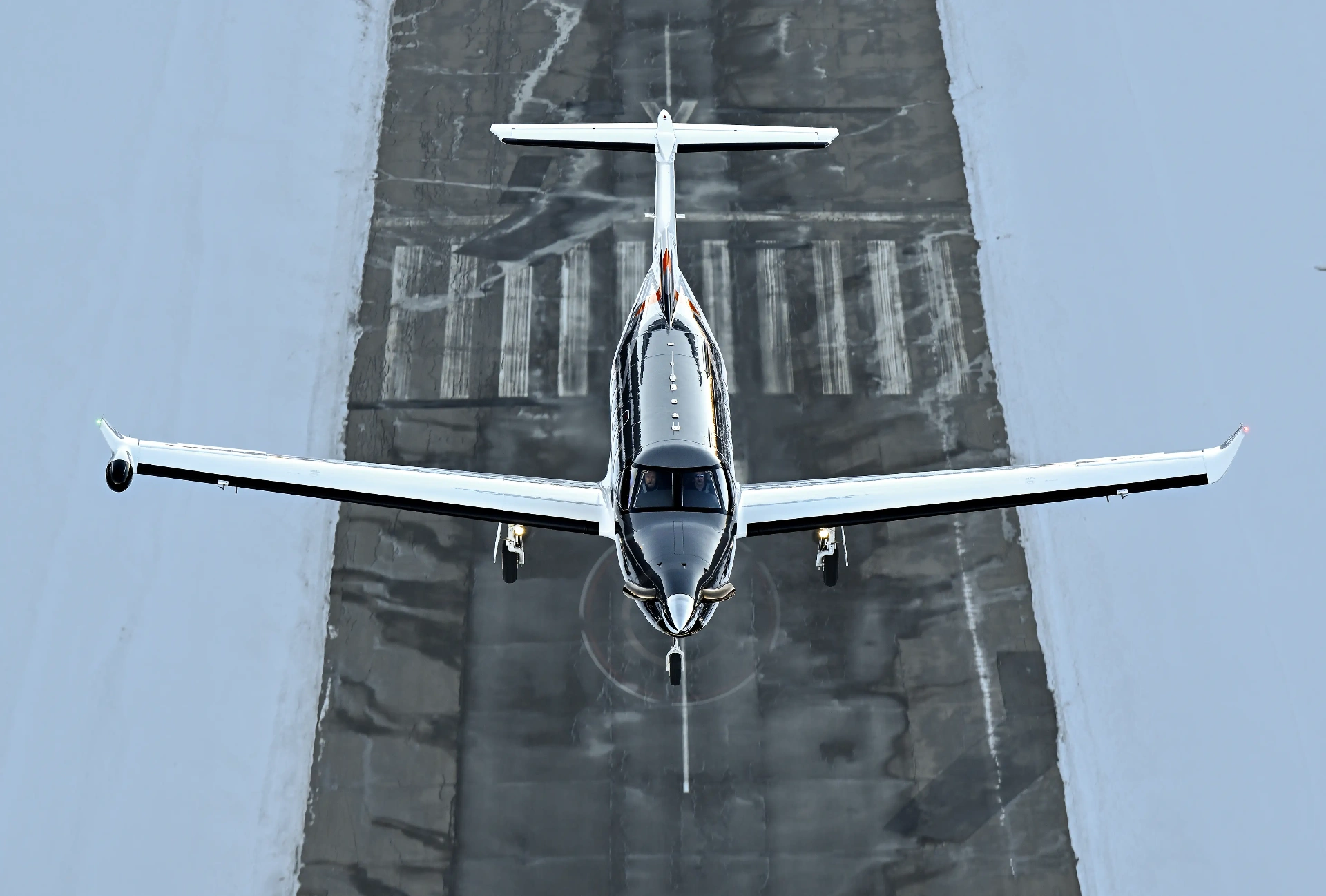Pilatus PC-12 turboprop on runway — island and mountain charter access