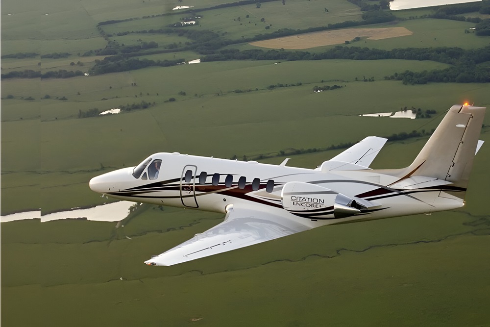 Cessna Citation Encore fying over the fields