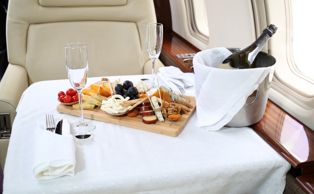 tray with delicious food in the CABIN HAUTE JETS CHARTERS, business class travel