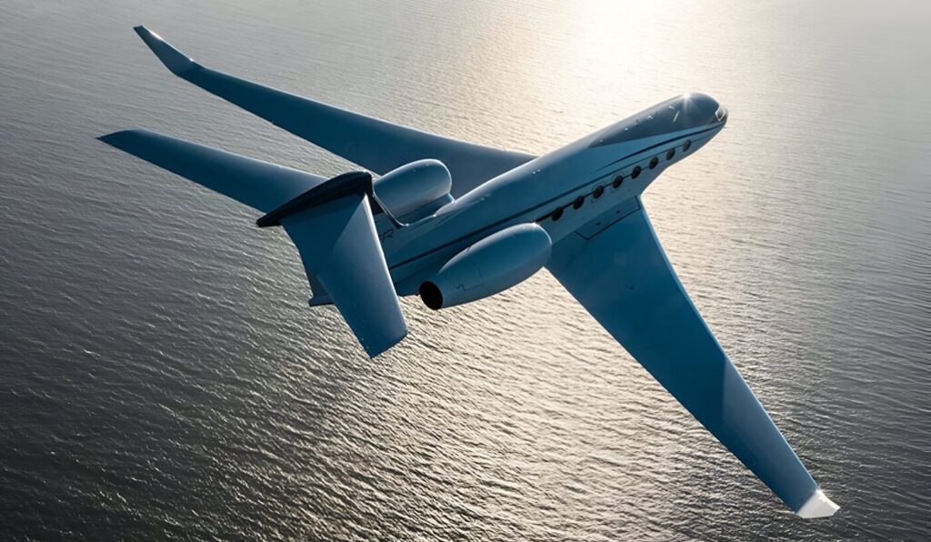 Gulfstream 650ER flying over the ocean