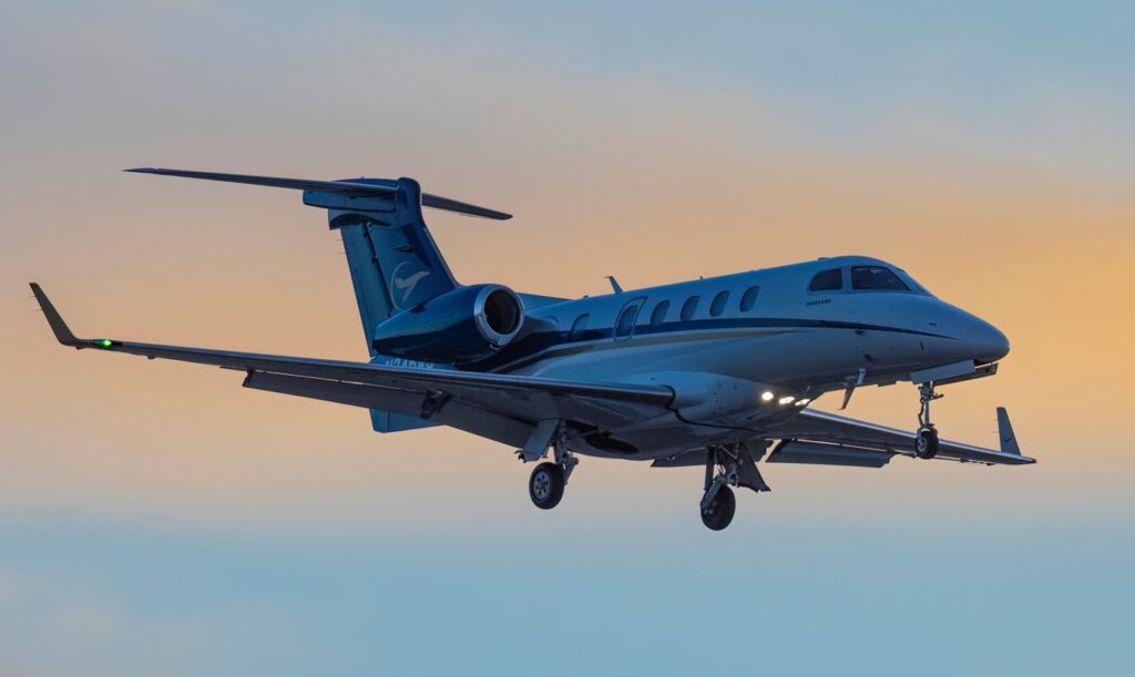 Embraer Phenom 300 arrives at the Centennial Airport at sunset