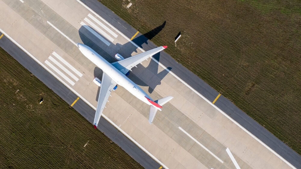 aerial view of airport terminal with parked airplanes