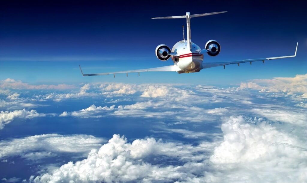 luxury airplane above sky, clouds