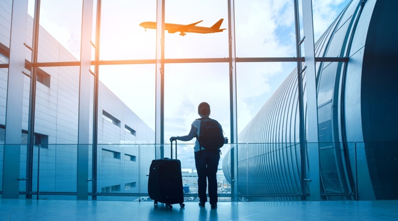 travel concept, woman in airport, passenger silhouette waiting with luggage in airport