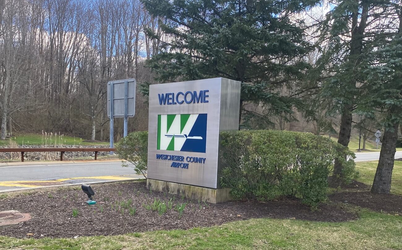 A welcome sign for Westchester County Airport