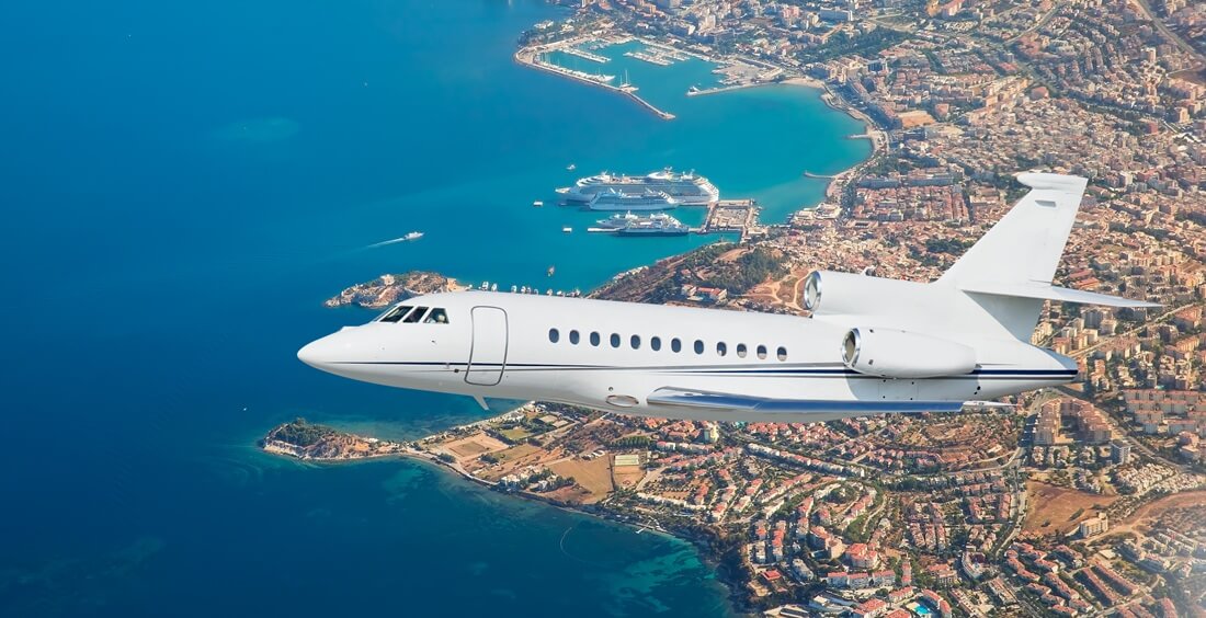 Luxury design private jet flying over the city