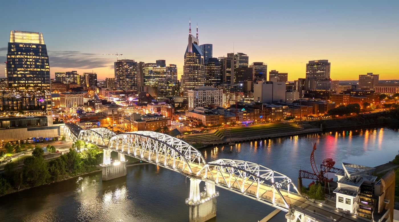 Nashville, Tennessee, USA skyline over the Cumberland River at golden hour