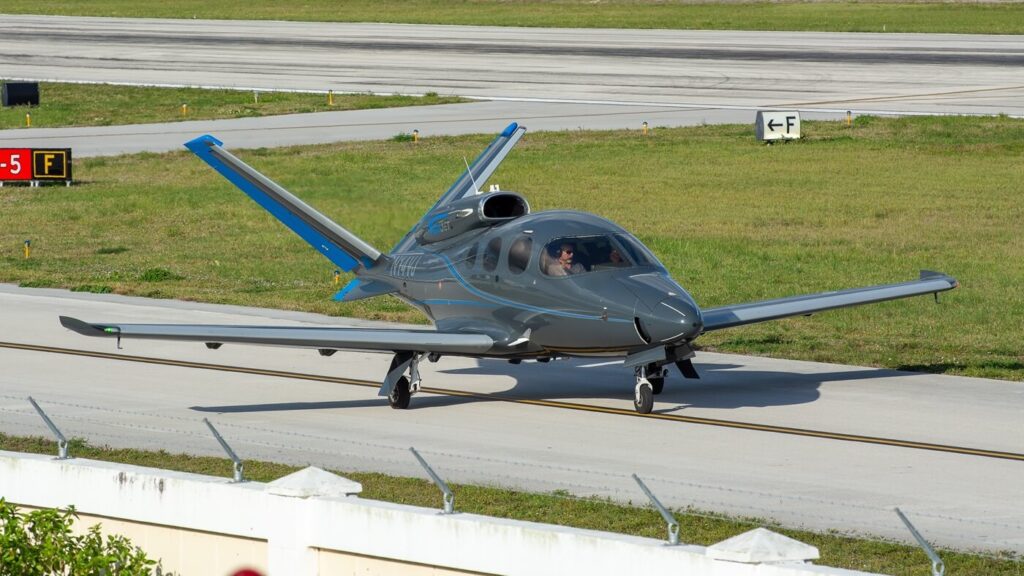 Small Cirrus Vision jet plane taxiing ready to take off from Boca Raton