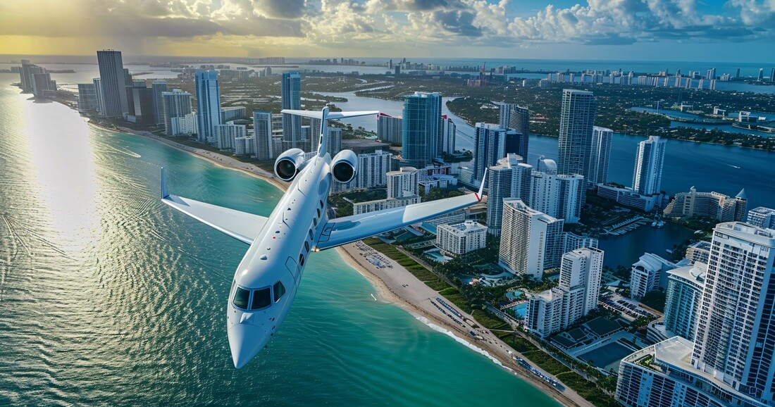 aerial view of white private jet flying over Miami