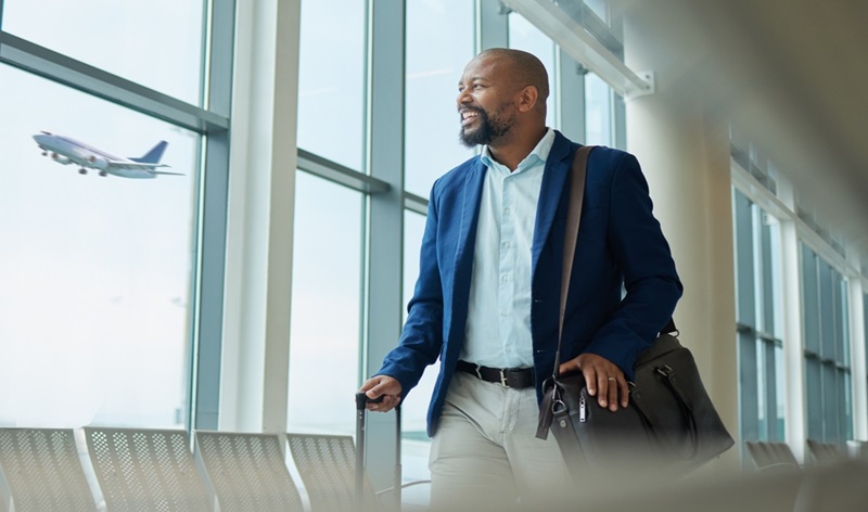 black man, business and travel at airport on airplane for professional trip