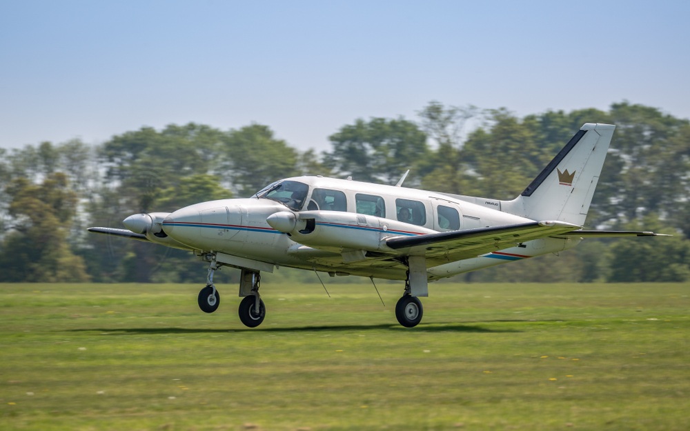 Piper PA-31 Navajo aircraft landing at airfield