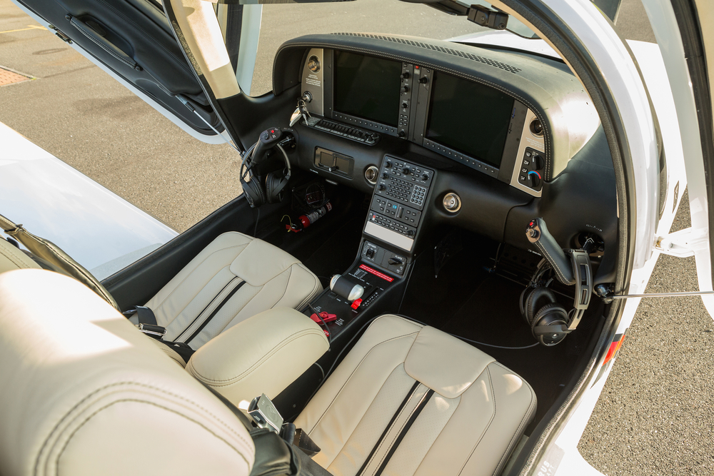 dashboard sports a small aircraft navigation devices and two large display. Interior single turboprop aircraft