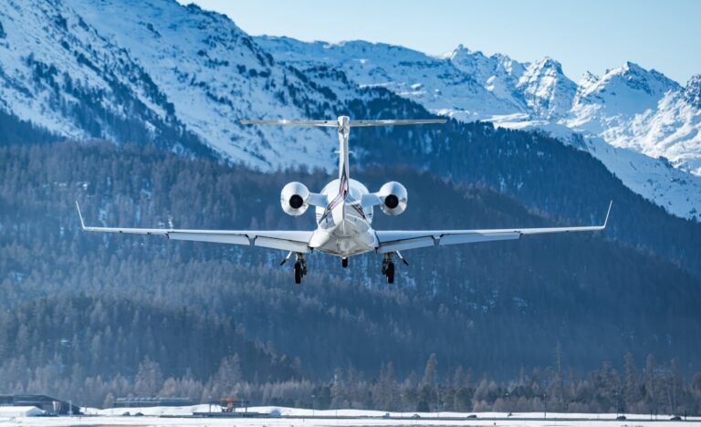 Business jet landing at the alpine airport in Samedan in the engadin valley in the Swiss alps