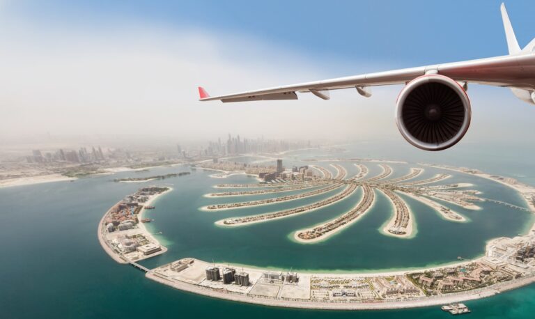 Detail of commercial jet plane flying above Dubai city