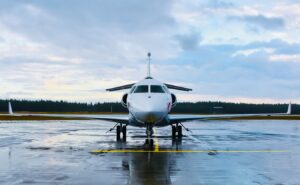 an airplane is parked on a wet runway