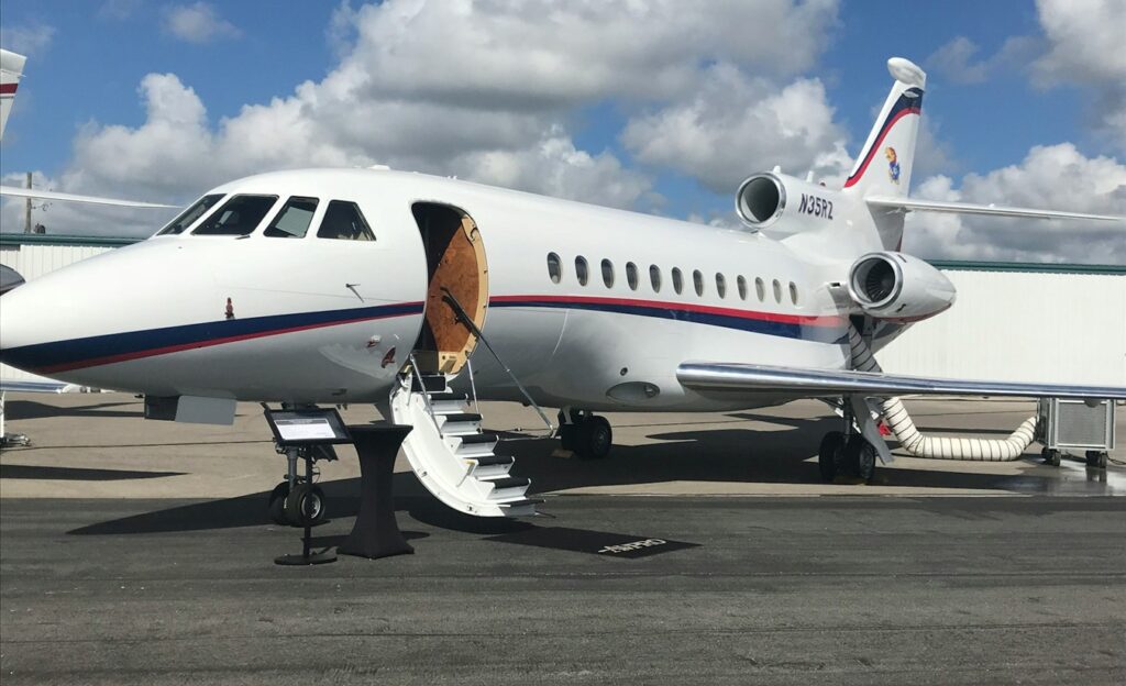 white airliner on gray pavement